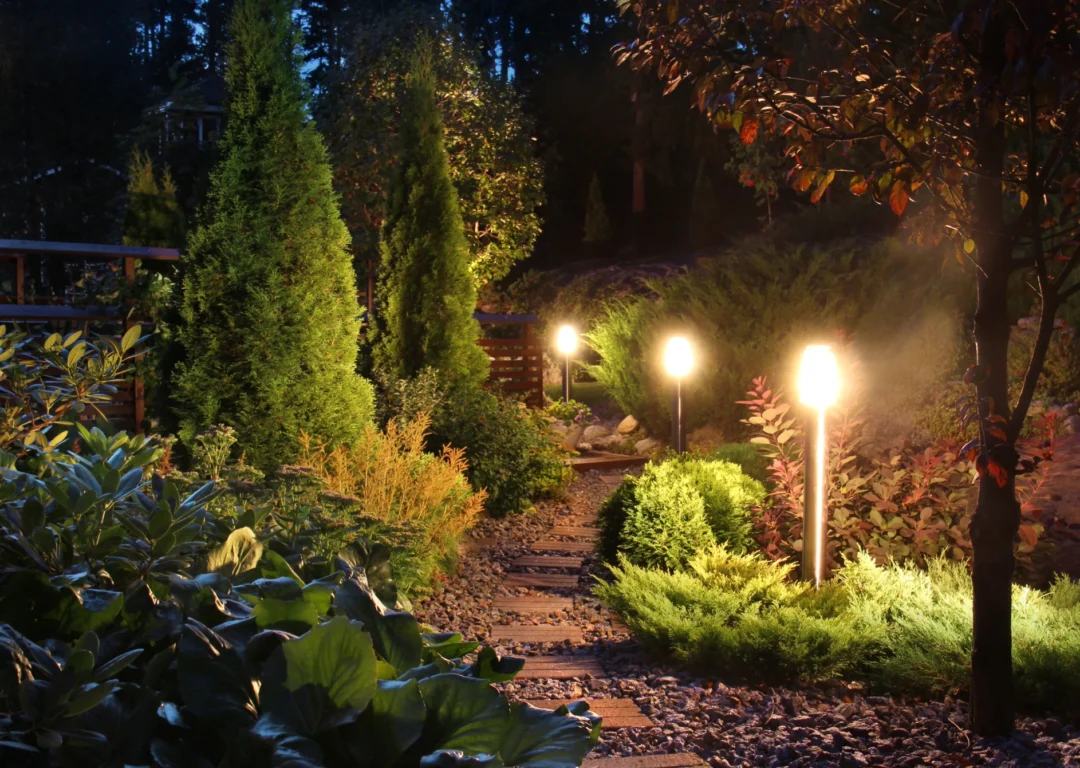 A series of three LED lights leading up a garden path.