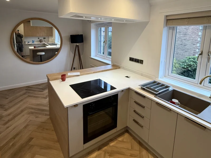 A kitchen peninsula with a built-in oven.