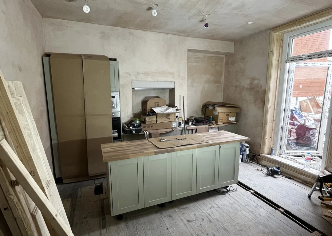 A spacious kitchen renovation featuring a large island, designed for functionality and style.